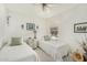 Bright bedroom with twin beds, patterned decor, and a window offering natural light at 19546 N 53Rd Ave, Glendale, AZ 85308