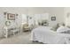 Bright bedroom with large windows, neutral carpet, and a relaxing area for reading at 19546 N 53Rd Ave, Glendale, AZ 85308