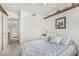 Comfortable bedroom showcasing a neatly made bed, wall decor, and closet space at 19546 N 53Rd Ave, Glendale, AZ 85308