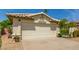Inviting front exterior featuring a well-maintained landscape and a spacious two-car garage at 19546 N 53Rd Ave, Glendale, AZ 85308