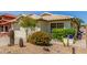 Charming home featuring a drought-resistant front yard with rock landscape, and decorative succulents at 19546 N 53Rd Ave, Glendale, AZ 85308