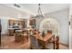 Eat-in kitchen with a chandelier, arched window and an adjacent island with seating, perfect for casual dining at 19546 N 53Rd Ave, Glendale, AZ 85308