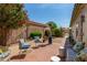 Charming brick patio with comfortable seating, heater and lush desert landscaping, perfect for outdoor entertaining at 19546 N 53Rd Ave, Glendale, AZ 85308
