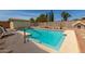 Inviting backyard pool with lounge chairs, privacy fence, and lush landscaping at 19546 N 53Rd Ave, Glendale, AZ 85308