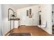 Bedroom with wood floors, minimalist decor, and two doors leading to other rooms at 1956 E Calle De Caballos --, Tempe, AZ 85284