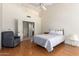 Cozy bedroom with vaulted ceiling, wood floors and door leading to the bathroom and walk-in closet at 1956 E Calle De Caballos --, Tempe, AZ 85284