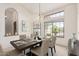 Elegant dining room with ample natural light, stylish chandelier, and seating for six at 1956 E Calle De Caballos --, Tempe, AZ 85284