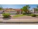 Charming home with a three-car garage, lush lawn, mature trees, and desert landscaping at 1956 E Calle De Caballos --, Tempe, AZ 85284