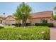 Charming home with a three-car garage, lush lawn, mature trees, and desert landscaping at 1956 E Calle De Caballos --, Tempe, AZ 85284