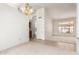 Spacious living room with carpet and tile flooring, natural light, and neutral colors at 1956 E Calle De Caballos --, Tempe, AZ 85284