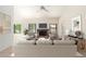 Staged living room featuring a fireplace, furniture, and neutral decor at 1956 E Calle De Caballos --, Tempe, AZ 85284