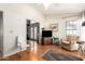 Inviting living room with hardwood floors, vintage chest and chair, and ample natural light at 1956 E Calle De Caballos --, Tempe, AZ 85284