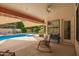 Inviting covered patio with a view of the sparkling pool and lush landscaping at 1956 E Calle De Caballos --, Tempe, AZ 85284
