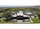 Aerial view of a community pool, ramada, and picnic area surrounded by palm trees and homes at 20545 W Terrace Ln, Buckeye, AZ 85396