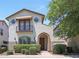 Charming two-story home with an arched entryway, small balcony, and well-maintained landscaping at 20545 W Terrace Ln, Buckeye, AZ 85396