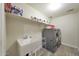Laundry room equipped with washer, dryer and sink at 20545 W Terrace Ln, Buckeye, AZ 85396