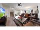Bright and airy living room with an open floor plan, tile flooring, and seamless transition to the outdoors at 20545 W Terrace Ln, Buckeye, AZ 85396
