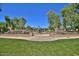 Community playground and green lawn areas with landscaping at 20545 W Terrace Ln, Buckeye, AZ 85396