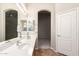Bright bathroom features double windows, soaking tub and large vanity at 20895 E Via Del Rancho Rd, Queen Creek, AZ 85142