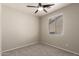 Empty bedroom with ceiling fan and window at 20895 E Via Del Rancho Rd, Queen Creek, AZ 85142