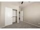 Empty bedroom with closet and neutral walls at 20895 E Via Del Rancho Rd, Queen Creek, AZ 85142