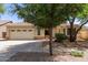 Charming single-Gathering home with a two-car garage, desert landscaping, and mature trees at 20895 E Via Del Rancho Rd, Queen Creek, AZ 85142