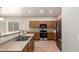 Functional kitchen featuring oak cabinets, stainless steel appliances, and tile flooring at 20895 E Via Del Rancho Rd, Queen Creek, AZ 85142