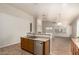 Kitchen featuring a breakfast bar, stainless steel appliances, and tile floors at 20895 E Via Del Rancho Rd, Queen Creek, AZ 85142