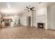 Open floor plan showcasing tile floors, a fireplace, and a kitchen with a breakfast bar at 20895 E Via Del Rancho Rd, Queen Creek, AZ 85142