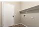 Mud room with a door, a shelf, and hookups for appliances at 20895 E Via Del Rancho Rd, Queen Creek, AZ 85142