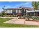 Exterior view of two-story home with well-manicured lawn and garden at 211 W Kaler Dr, Phoenix, AZ 85021