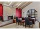 Living room with brick fireplace, vaulted ceilings, and natural light from window at 211 W Kaler Dr, Phoenix, AZ 85021