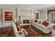 Elegant living room featuring a marble fireplace and hardwood floors at 211 W Kaler Dr, Phoenix, AZ 85021