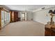 Bright main bedroom with patterned wallpaper, carpet, and closet at 211 W Kaler Dr, Phoenix, AZ 85021
