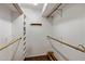 Organized walk-in closet with built-in shelving and ample storage space at 211 W Kaler Dr, Phoenix, AZ 85021