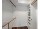 Walk-in closet with shelving and wood floor at 211 W Kaler Dr, Phoenix, AZ 85021
