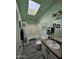 Cozy bathroom featuring a bathtub, sink, toilet and a skylight that brightens up the room at 2121 N Center St # 131, Mesa, AZ 85201