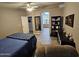 Spacious bedroom featuring ceiling fan and a relaxing recliner at 2121 N Center St # 131, Mesa, AZ 85201
