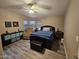 Comfortable bedroom with ceiling fan, and a relaxing recliner at 2121 N Center St # 131, Mesa, AZ 85201