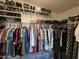 Spacious walk-in closet with ample storage and organized shelving for shoes and clothing at 2121 N Center St # 131, Mesa, AZ 85201