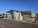 Inviting exterior of a well-maintained home with covered parking, mature trees, and manicured landscape at 2121 N Center St # 131, Mesa, AZ 85201