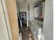 Efficient laundry room with washer, dryer, storage cabinets and hanging rack at 2121 N Center St # 131, Mesa, AZ 85201