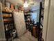 Walk-in closet with ample storage space, shelving units and a fan at 2121 N Center St # 131, Mesa, AZ 85201