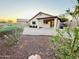 Enjoy this private backyard with a covered patio and easy to maintain desert landscaping at 22951 W Loma Linda Blvd, Buckeye, AZ 85326