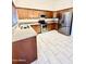 This kitchen boasts stainless appliances, granite countertops, and tile flooring at 22951 W Loma Linda Blvd, Buckeye, AZ 85326