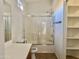 Bathroom featuring shower, bathtub and sliding glass shower doors at 2402 E 5Th St # 1472, Tempe, AZ 85288