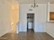 A hallway leads to a staircase, a laundry room and the living room, creating a functional and seamless flow at 2402 E 5Th St # 1472, Tempe, AZ 85288