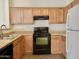 Well-equipped kitchen with modern appliances, ample cabinet space, and a functional layout for cooking ease at 2402 E 5Th St # 1472, Tempe, AZ 85288