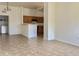 Open-concept living area connected to kitchen provides ample space, natural light, and easy access to laundry at 2402 E 5Th St # 1472, Tempe, AZ 85288