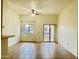 Spacious living room features a ceiling fan, and sliding door offering access to a balcony with views at 2402 E 5Th St # 1472, Tempe, AZ 85288